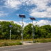 Solar panels above the highway to illuminate the road. Renewable energy with the help of the sun.